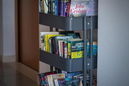 a book shelf filled with lots of books at Apartments Didan in Cavtat