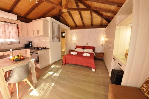 Postel nebo postele na pokoji v ubytování San George Apartments