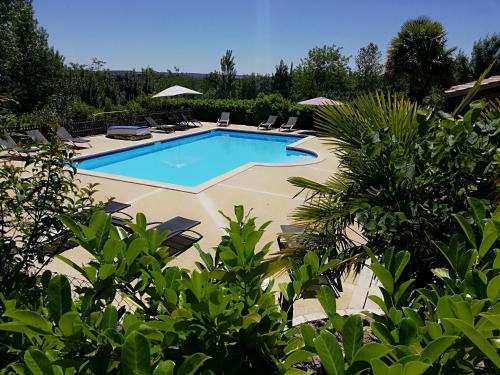 The swimming pool at or close to Les Chalets de Grazimis