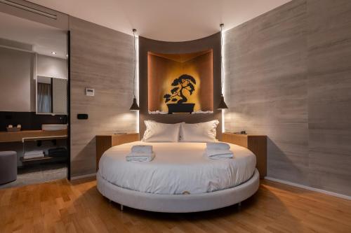 a bedroom with a large white bed in a room at Onira Suite Dreams in Hersonissos