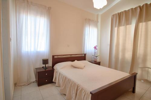 Postel nebo postele na pokoji v ubytování Villa Persifonia