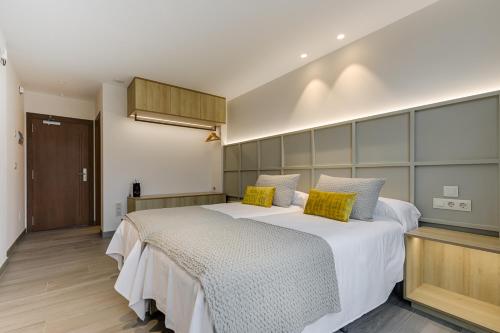 Ένα ή περισσότερα κρεβάτια σε δωμάτιο στο A Casa do Latoneiro