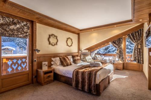 Ένα ή περισσότερα κρεβάτια σε δωμάτιο στο Hôtel Les Sherpas