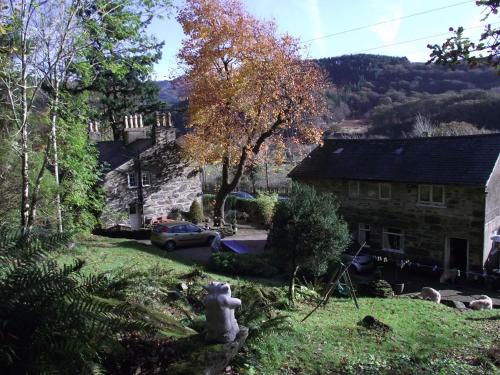 a fire hydrant in the yard of a house at Red Dragon Cottages nr Mt Snowdon in Beddgelert