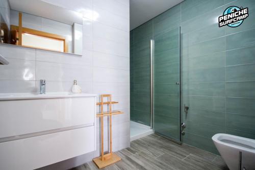 a bathroom with a sink and a shower at Ocean Two & Three Room Apartments in Peniche