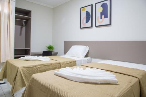 Säng eller sängar i ett rum på Juazeiro Comfort Hotel