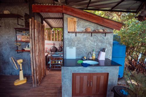a kitchen with a sink and a counter top at Krabilife Resort in Klong Muang Beach