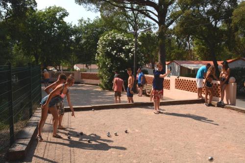 a group of people standing around in a park at Camping Montana Parc - Gassin Golfe de St Tropez - Maeva in Gassin