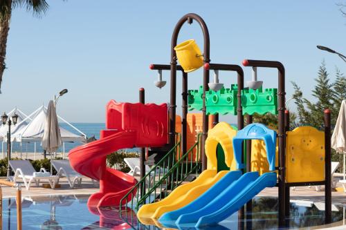 a water park with a slide in a swimming pool at Grand Blue Fafa Resort & SPA in Golem