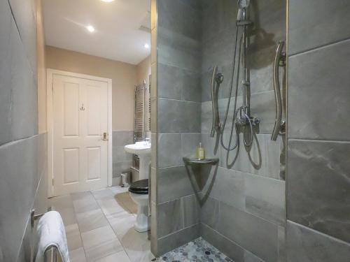 a bathroom with a shower and a sink at Coul House Hotel in Contin