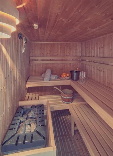 an inside of a sauna with a grill in it at Penthouse & Garden - luxury apartment in Postal