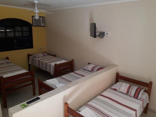 Cama o camas de una habitación en Suítes Vila Maresias