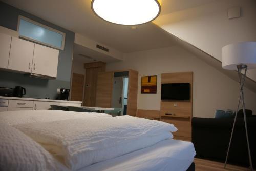Katil atau katil-katil dalam bilik di Leister Apparthotel