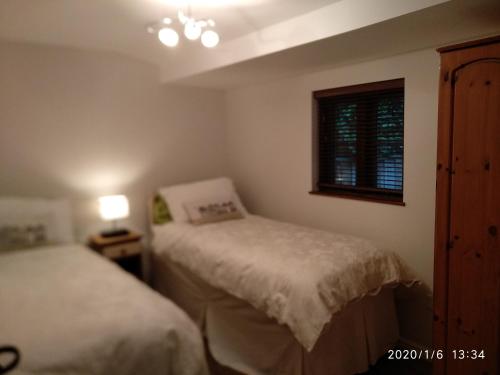 Кровать или кровати в номере Glen Lodges