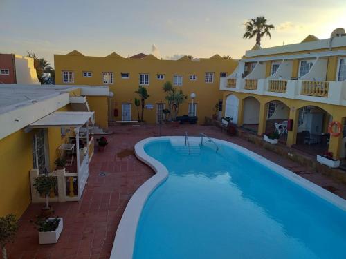 a view of the pool from the balcony of a hotel at Dream House in Caleta De Fuste