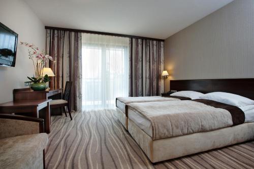 Katil atau katil-katil dalam bilik di Hotel SPA Budowlani