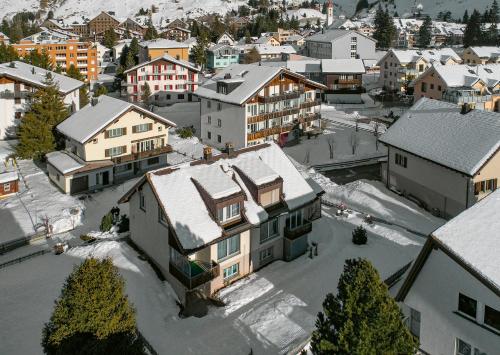 an aerial view of a town with snow covered buildings at Haus Sonnboden in Andermatt