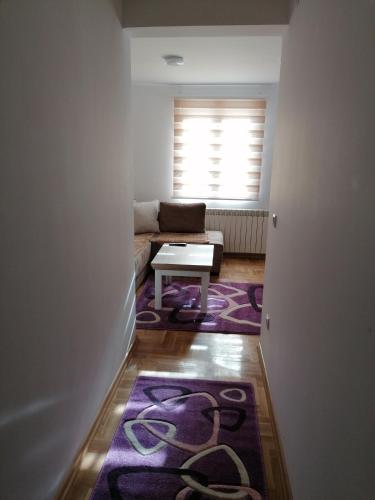 a living room with a couch and a table at Vila Meridijan in Zlatibor