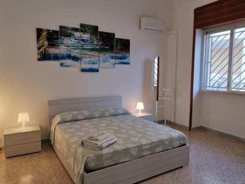 Postel nebo postele na pokoji v ubytování Villetta Vivaldi 2