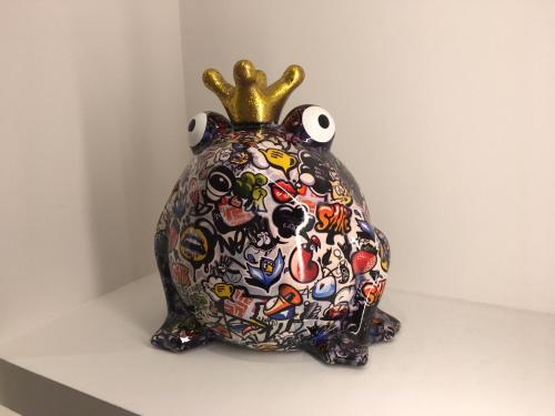 a vase with a crown on top of it at Torri & Portici in Bologna