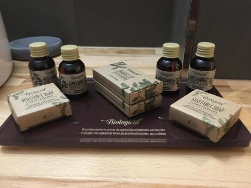 a tray with four bottles of honey and cheese at Torri & Portici in Bologna