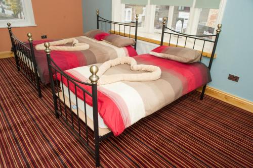 Säng eller sängar i ett rum på Fountain Hotel
