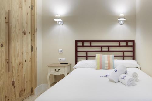 Кровать или кровати в номере Kursaal - Basque Stay