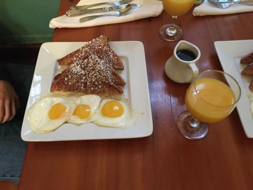 a plate of eggs and toast on a table at Cleveland House Inn in Newport