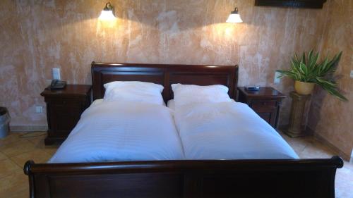 Un pat sau paturi într-o cameră la Gästehaus Chalet Ochtrup