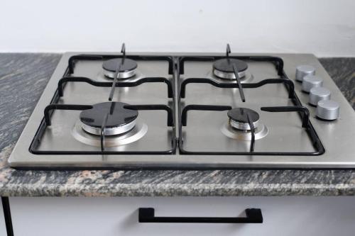 a stove top oven sitting on top of a counter at Amaze Residence luxury 2bedroom apartment 1 in Boralesgamuwa