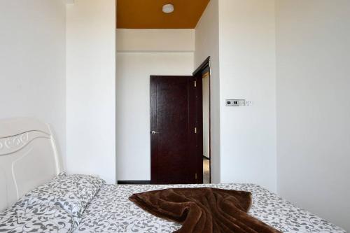 a bedroom with a bed with a blanket on it at Amaze Residence luxury 2bedroom apartment 1 in Boralesgamuwa