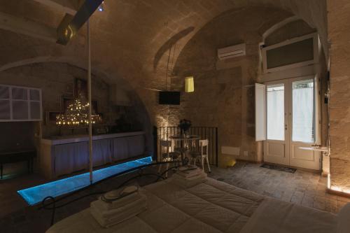 a room with a pool in the middle of a building at LUX LUCIS in Matera
