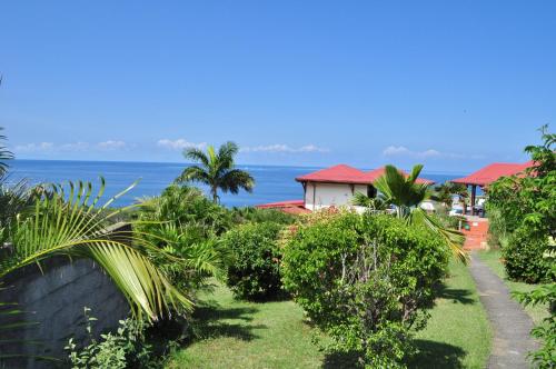 a view of the ocean from a resort at Infiniti Blue in Bouillante