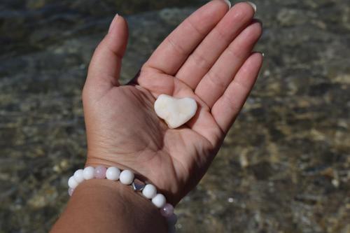 a person holding a heart in their hand at Asmanis Rooms in Tarti