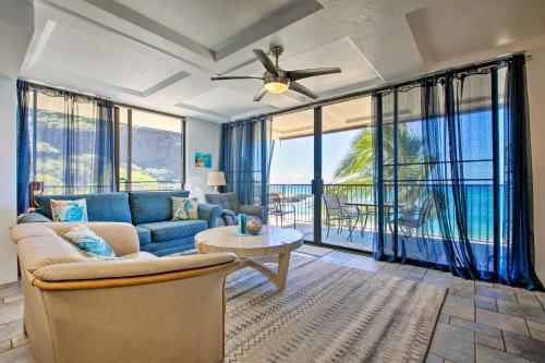 a living room with a couch and a ceiling fan at Stunning Makaha Condo with Pool Access and Ocean View! in Waianae