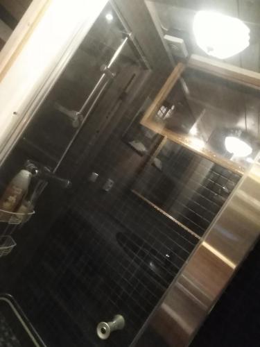 an overhead view of a kitchen with black tiles at Roliga semestrar i Åhus! in Åhus
