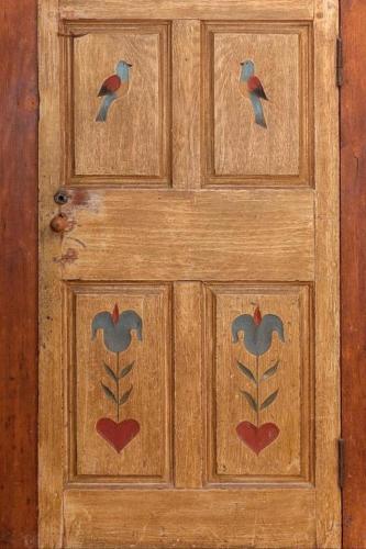a wooden door with two birds on it at Large 1 Bedroom Apartment, Home Theater, Fireplace in Berkeley