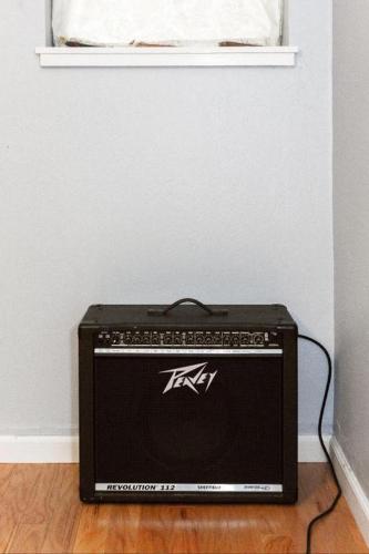 a radio sitting on the floor under a window at Large 1 Bedroom Apartment, Home Theater, Fireplace in Berkeley