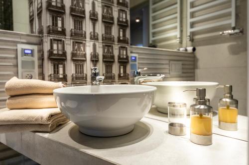 a bathroom with a bowl sink on a counter at 2/3 APARTMENTS Old Town in Wrocław