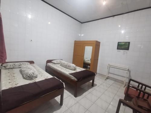 Postel nebo postele na pokoji v ubytování Hotel Paviljoen