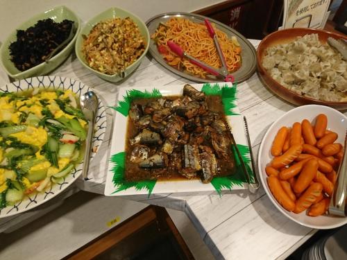 a table topped with plates of food and bowls of food at Toyohashi Station Hotel in Toyohashi