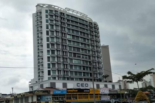 a tall white building with a lot of windows at SY Staycation - Studio in Bayan Lepas