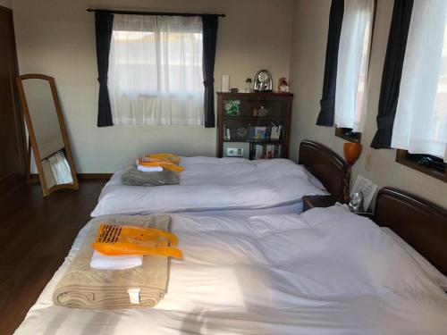 Postel nebo postele na pokoji v ubytování Guesthouse Gifu SUAI