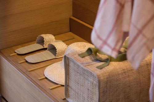 a display of hats on a counter in a room at Potato Head Suites & Studios in Seminyak