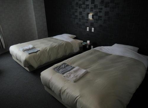 Ένα ή περισσότερα κρεβάτια σε δωμάτιο στο Hotel Crown Hills Kushiro