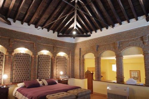 Postel nebo postele na pokoji v ubytování Hotel Palacio de Oñate