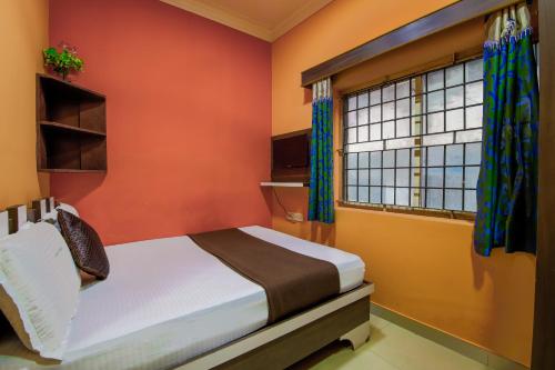 Ένα ή περισσότερα κρεβάτια σε δωμάτιο στο Lusia Inn