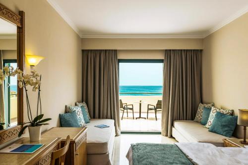 a hotel room with a view of the ocean at Mitsis Rodos Maris in Kiotari