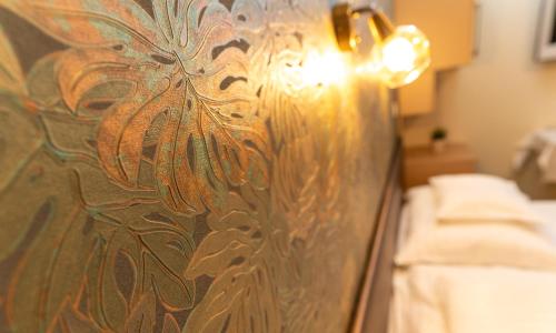 a close up of a glass wall in a room at Teátrum Boutique Hotel in Győr
