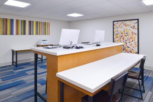 an office with a desk and a chair in a room at Holiday Inn Express & Suites - Shreveport - Downtown by IHG in Shreveport